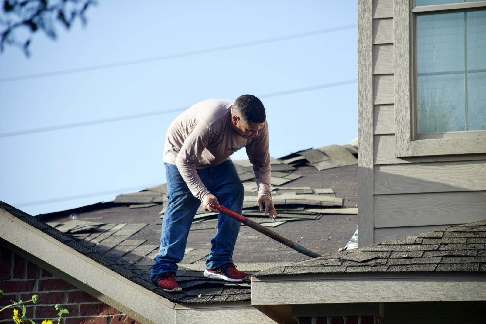 Toro Roofing crew replacing a roof in Orange County